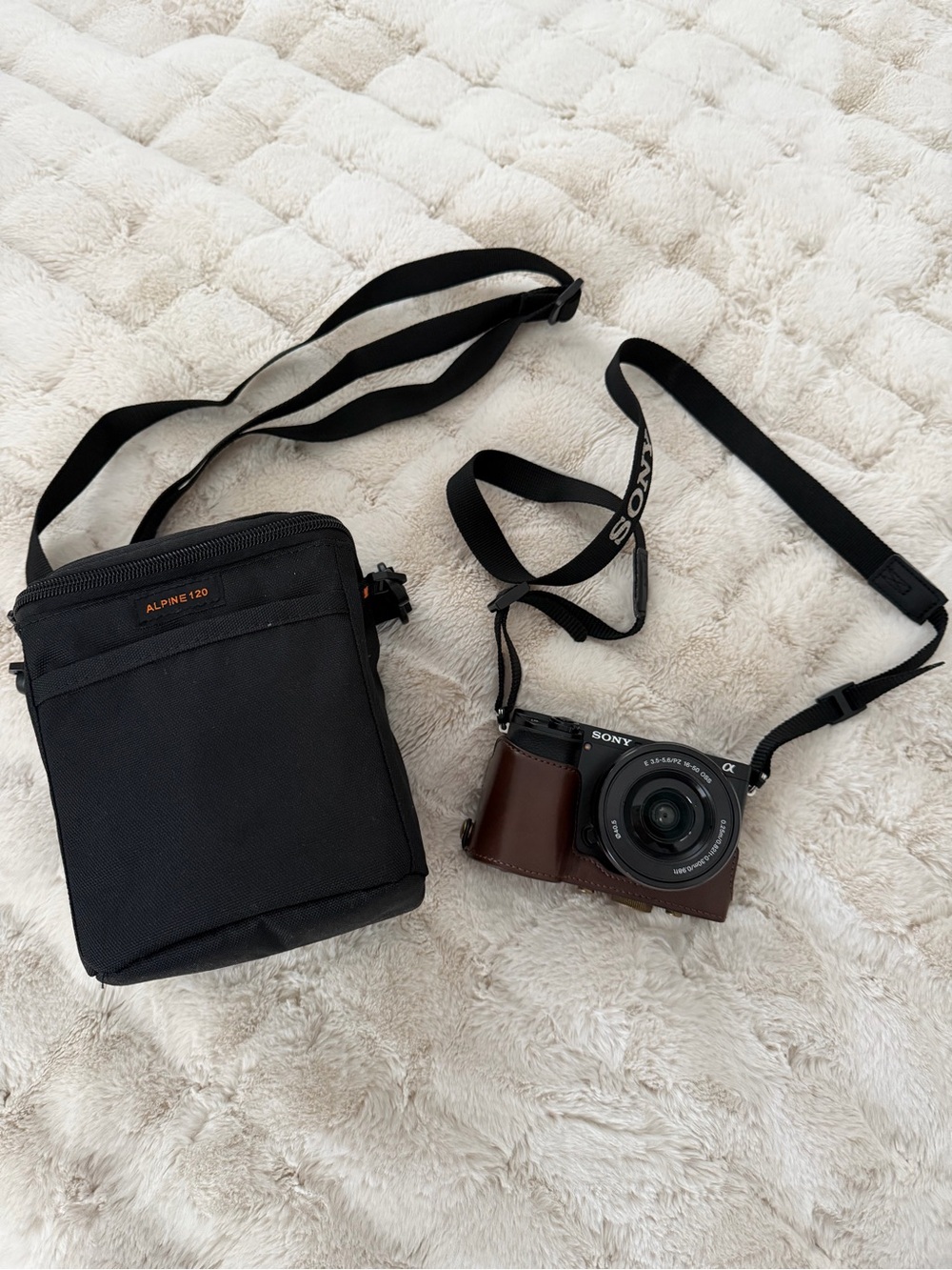 Sony Mirrorless Camera with Brown Leather Half Case and Black Strap & Carry Bag